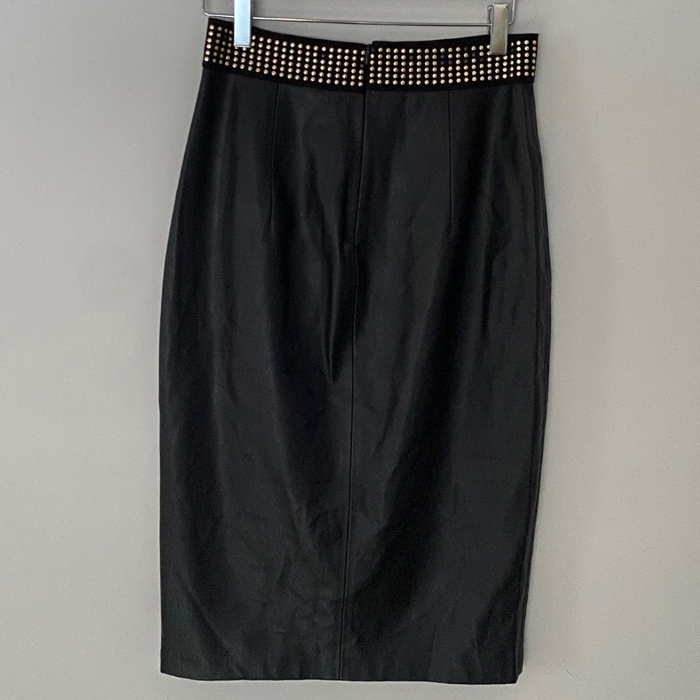 Black faux leather pencil skirt with gold and black studs